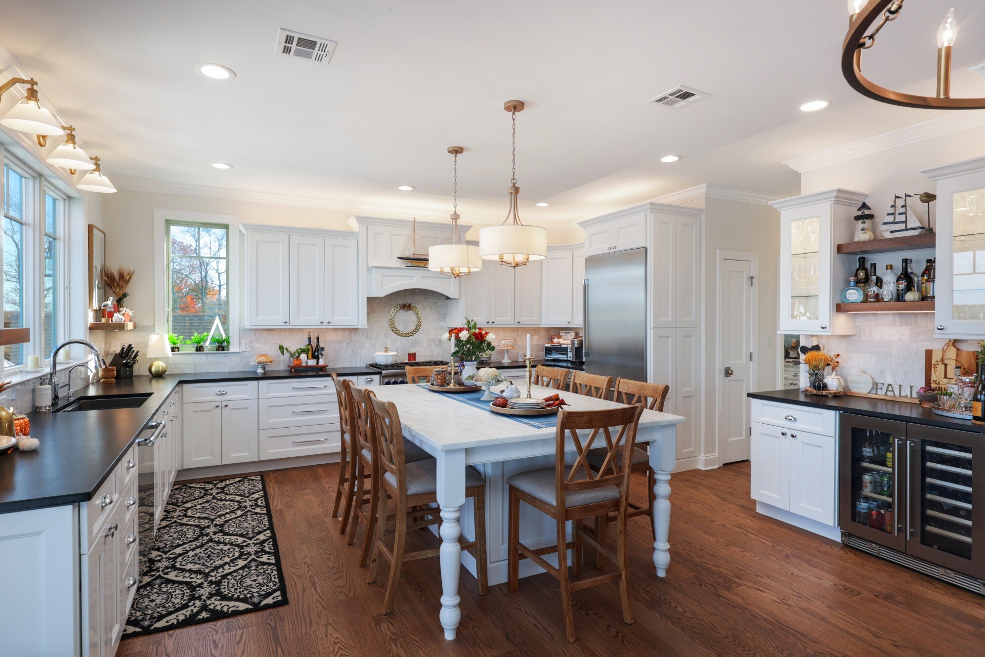 Elegant kitchen in a custom home by GTG Builders in Brick, NJ, featuring a large island, high-end appliances, and a beverage station