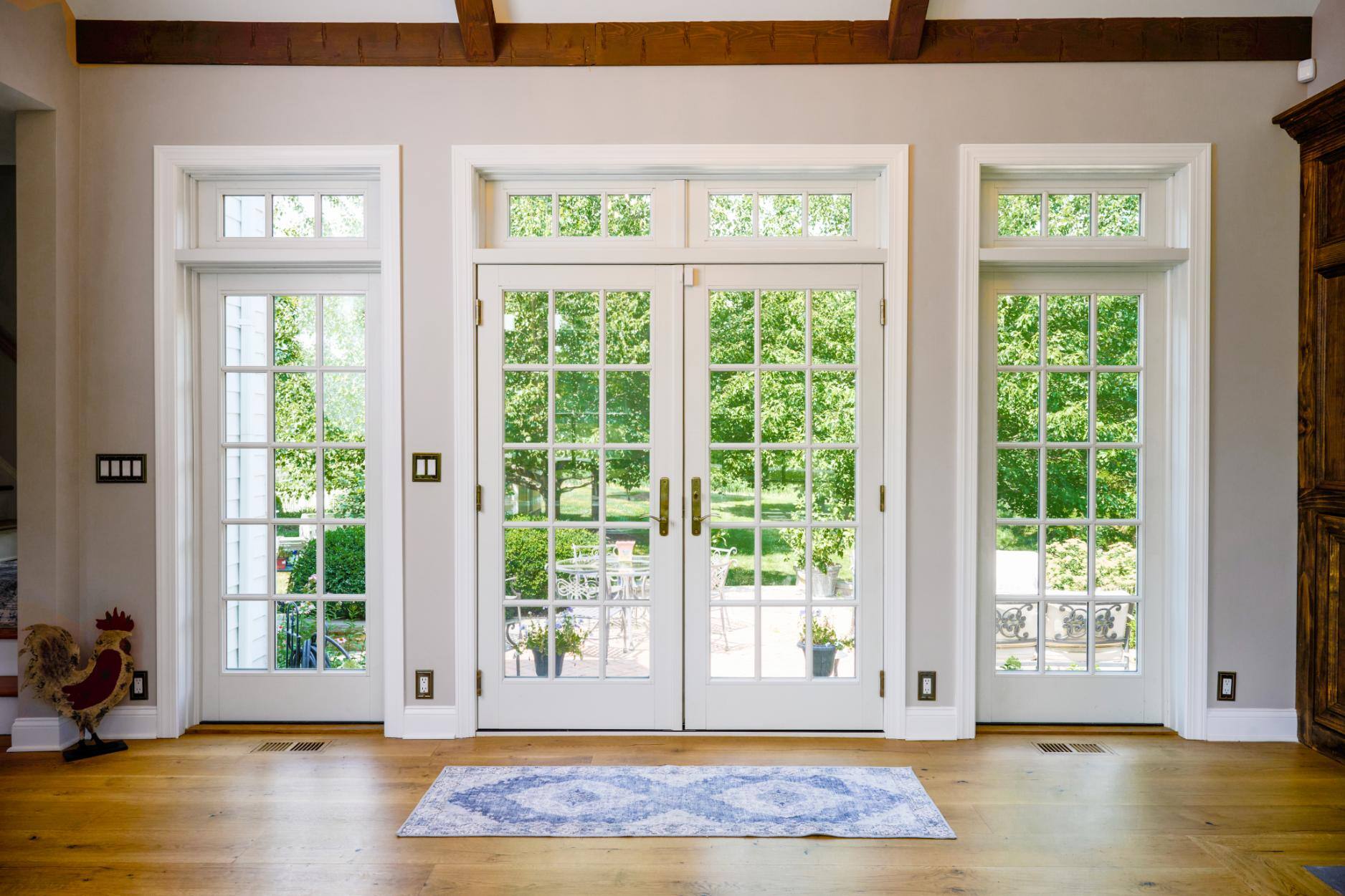 4-season room addition French doors to patio by GTG Builders in Central, NJ
