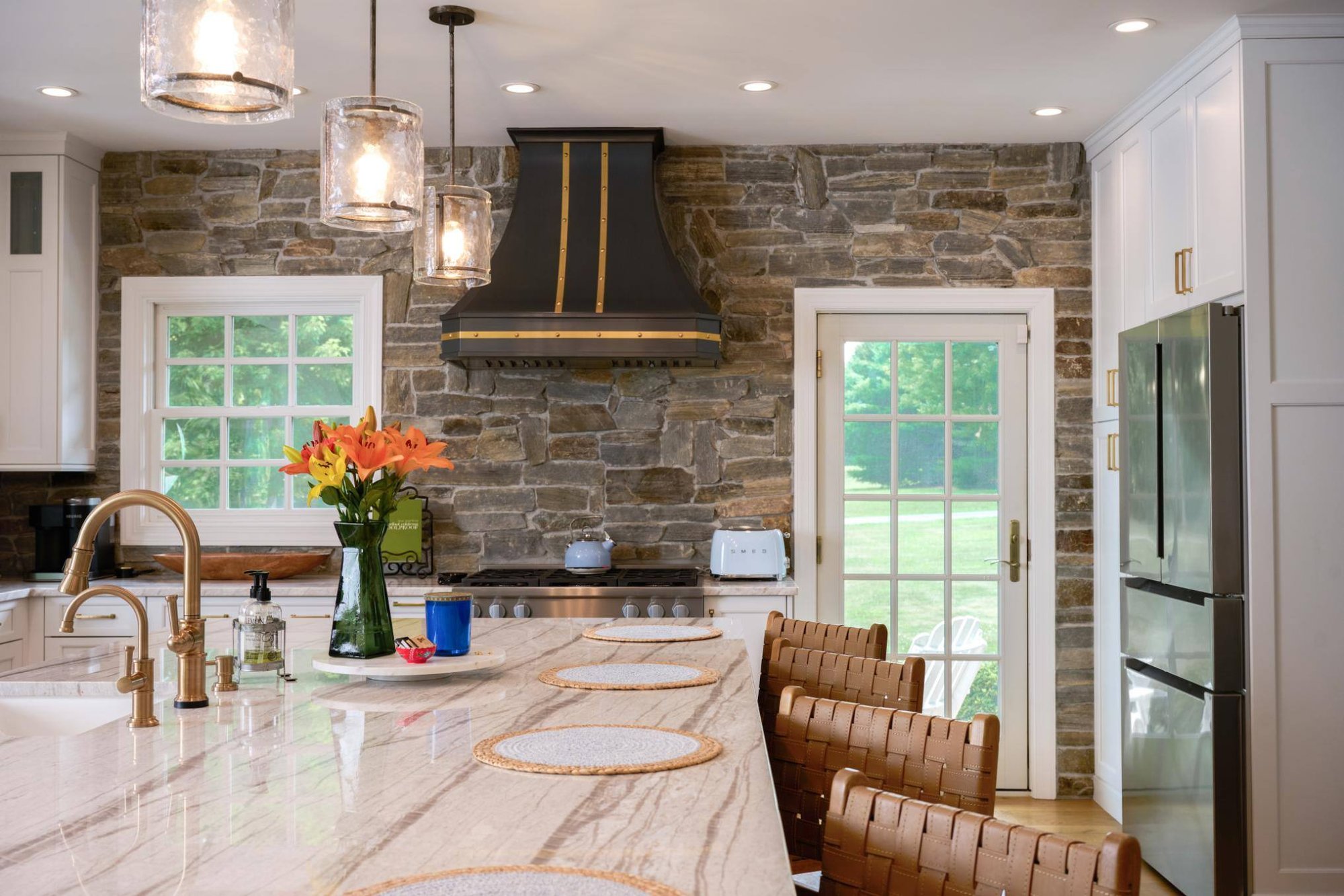 Kitchen area with stove and island in 4-season room addition by GTG Builders in Central, NJ Kitchen area with stove and island in 4-season room addition by GTG Builders in Central, NJ