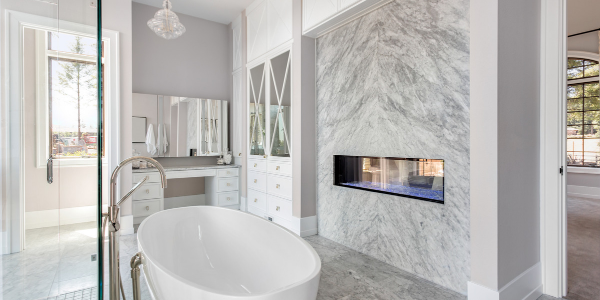 Modern bathroom with marbled walls and vanity area
