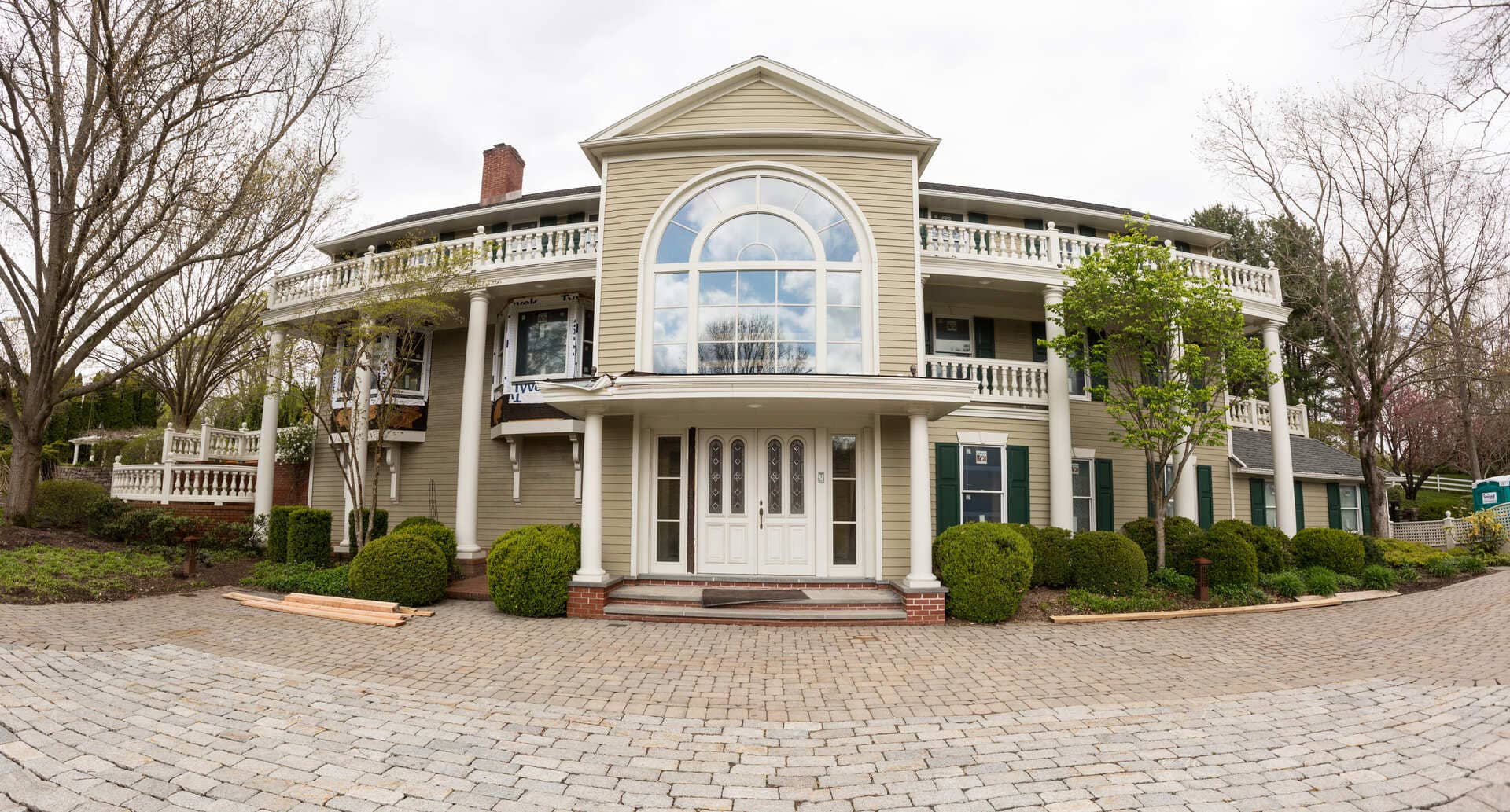 custom home with large window in potterstown nj by GTG custom home builders