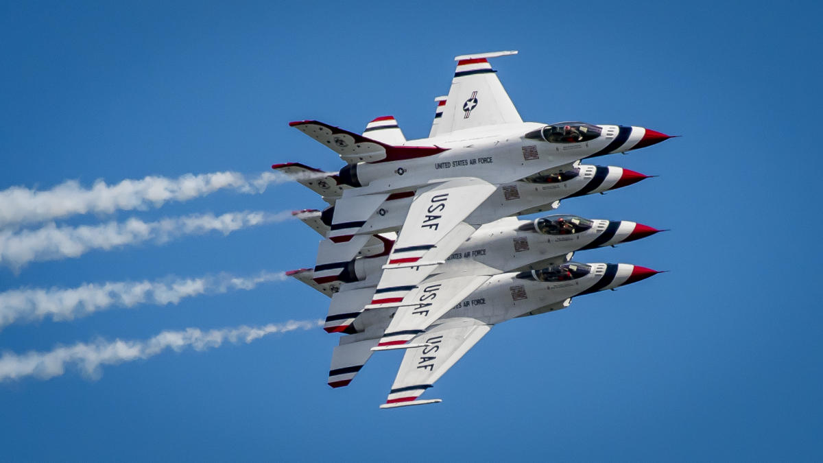 4 airplanes flying side by side at the great pocono raceway airshow - photo by discover lehigh valley