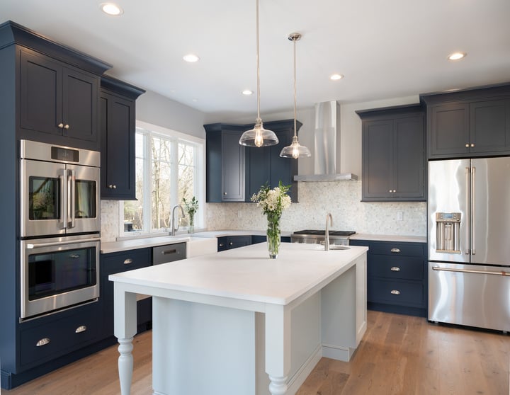 kitchen in custom home with hardwood floors and blue cabinets by GTG Builders in Central New Jersey