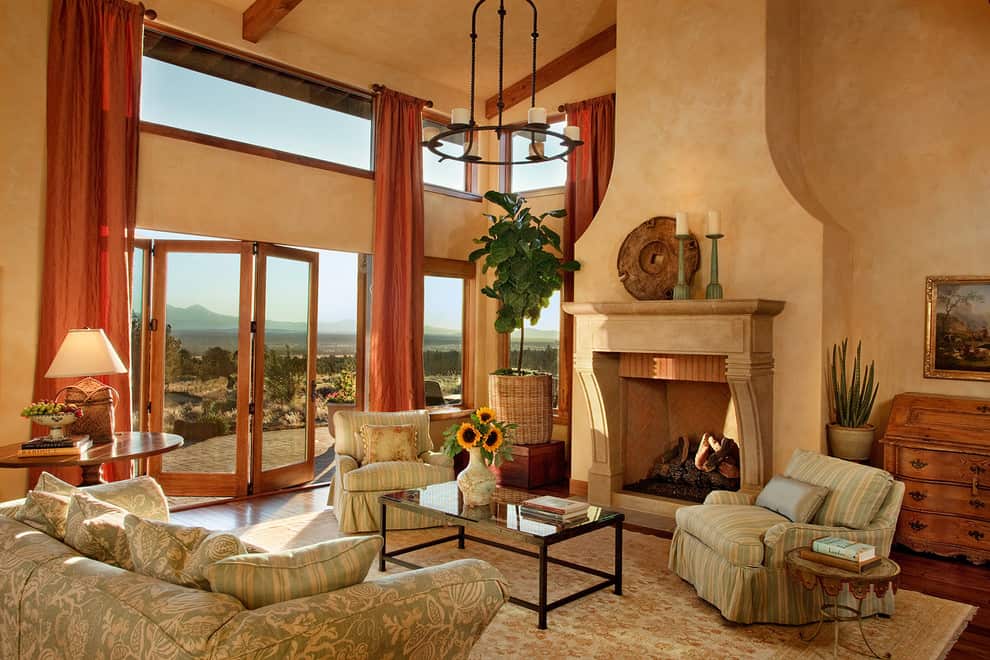 tuscan style living room with clay fireplace - photo by Decor Snob