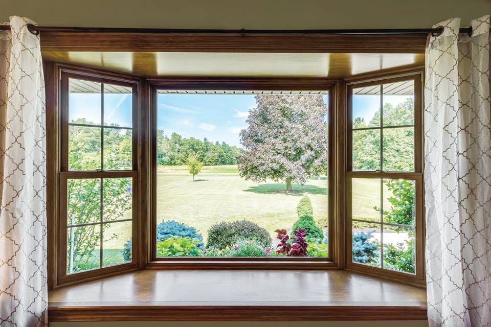 bay window with white curtains - photo by window-guide