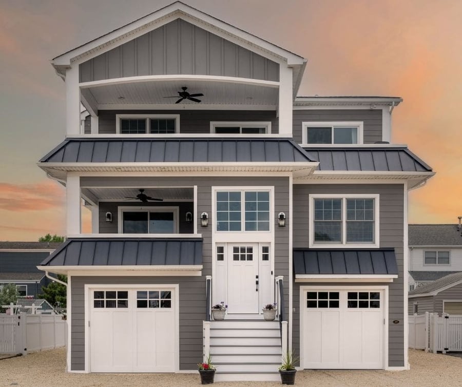 grey beach house in beach haven with 2 garages by GTG builders