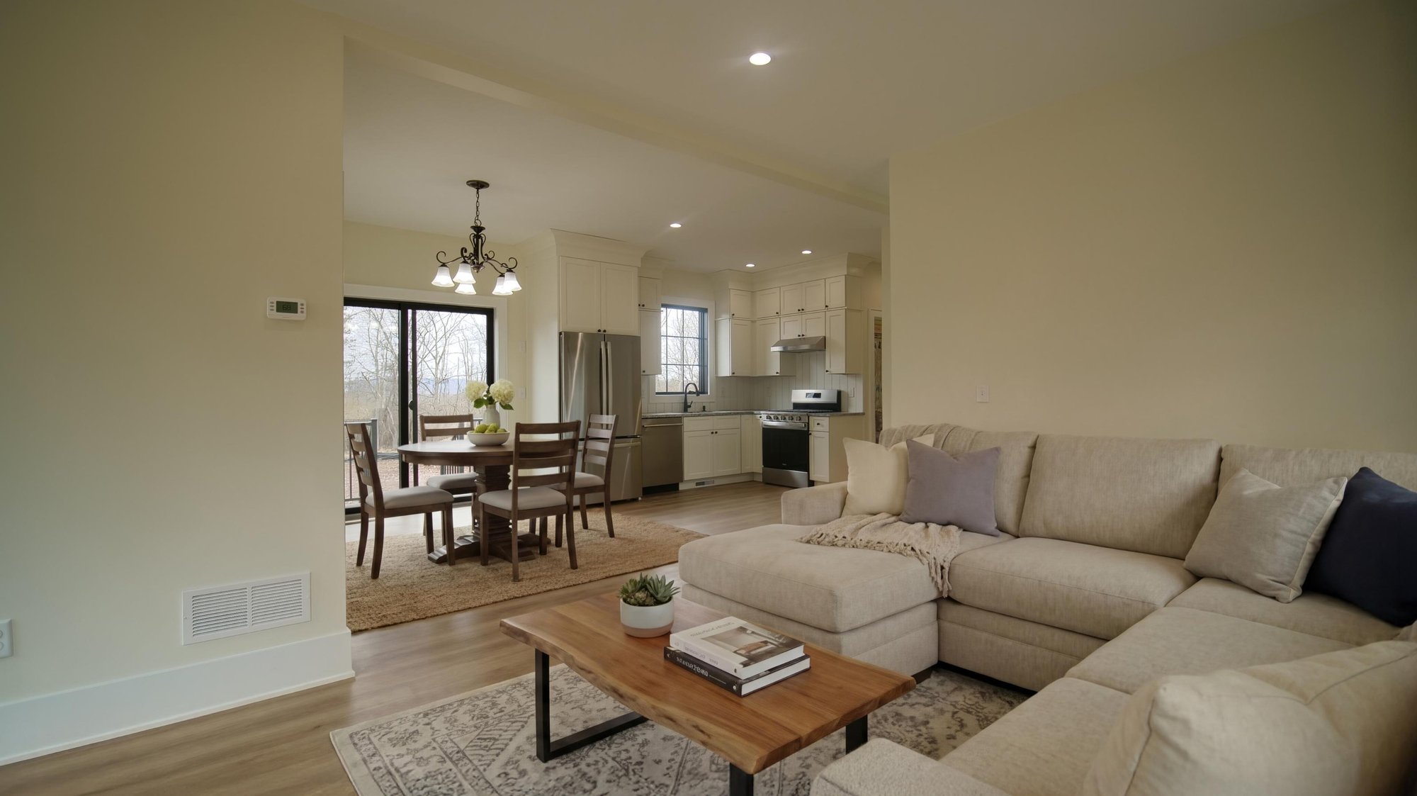 family room, dining nook, and kitchen by gtg builders