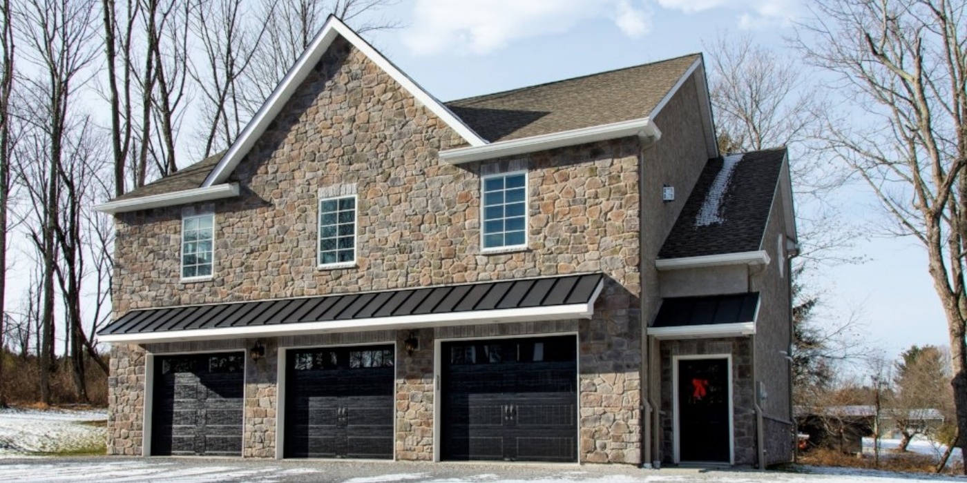 exterior of custom home with 3 car garage and stone by gtg builders in central new jersey exterior of custom home with 3 car garage and stone by gtg builders in central new jersey