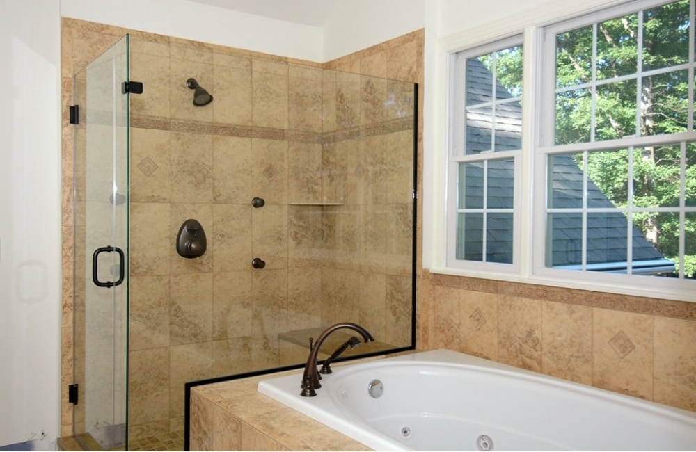 bathroom with tub and walk in show in custom home by gtg builders in central new jersey