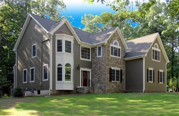 Exterior of Large Custom Home With Sonte Work and Large Front Lawn in Central, NJ by GTG Builders