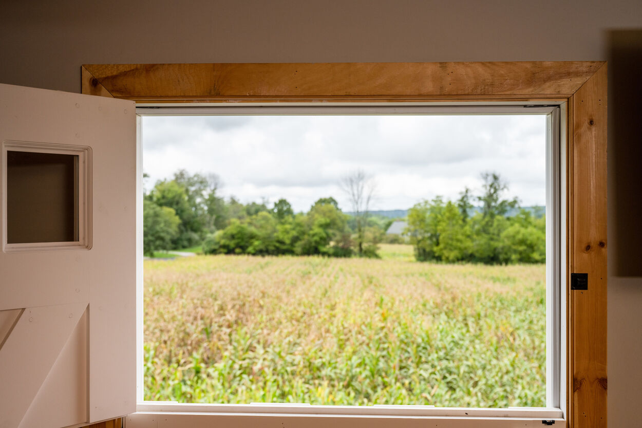 door leading to open field by GTG Builders in Stockton, New Jersey