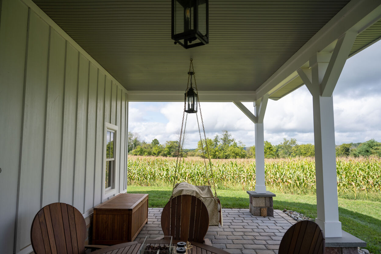 covered white porch by GTG Builders in Stockton, New Jersey