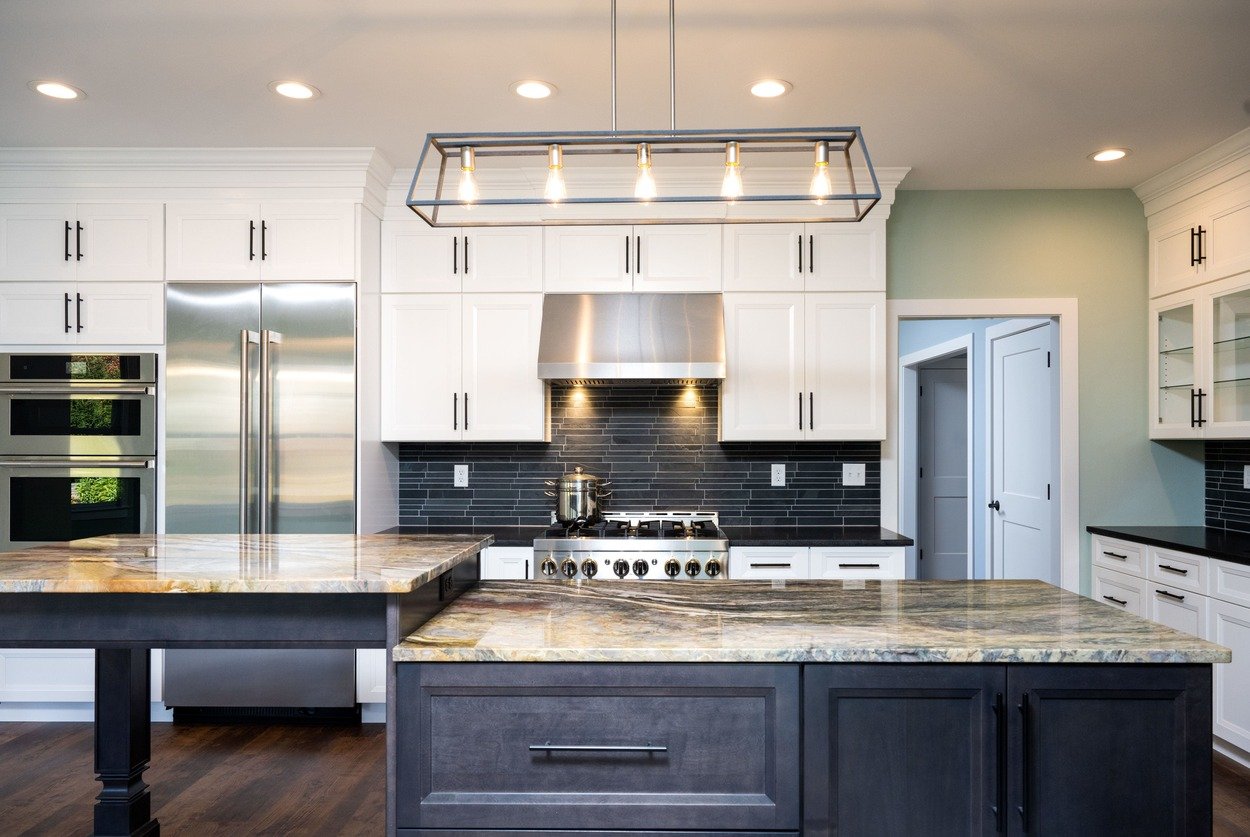 custom kitchen with two level island and white cabinets by GTG Builders in Central New Jersey