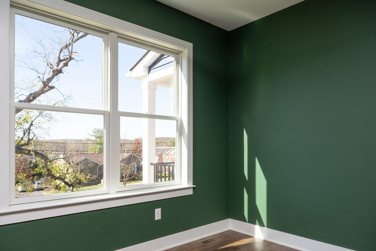 room with window and green walls in custom home by GTG Builders in Central New Jersey