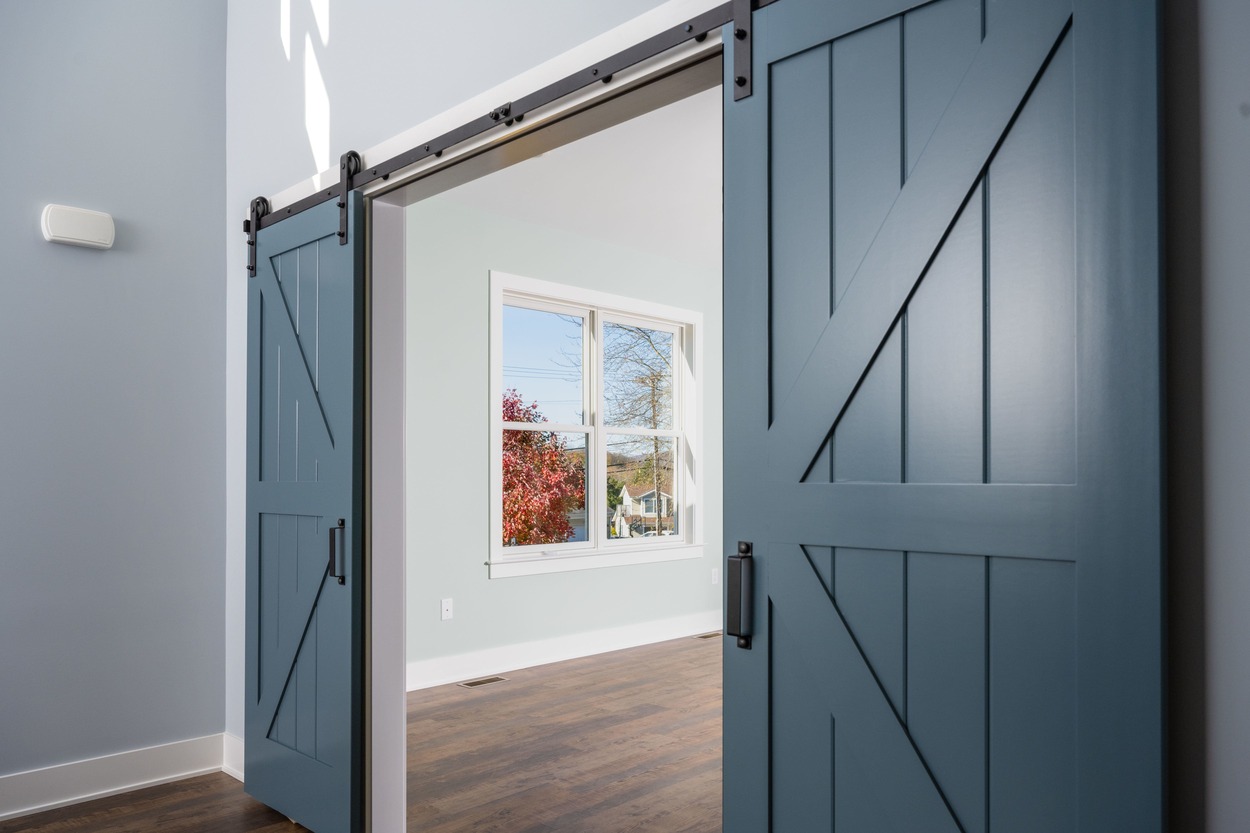 close shot of barn style sliding doors in custom home by GTG Builders in Central New Jersey