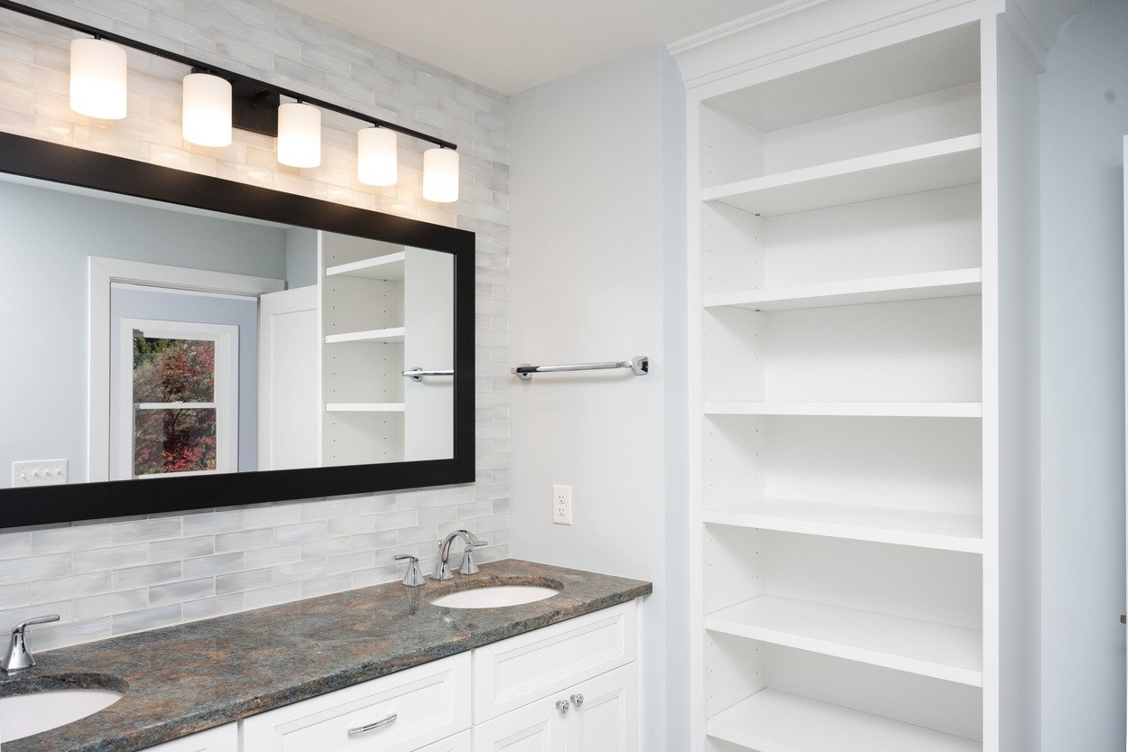 custom bathroom with white shelves and grey tile backsplash by GTG Builders in Central New Jersey