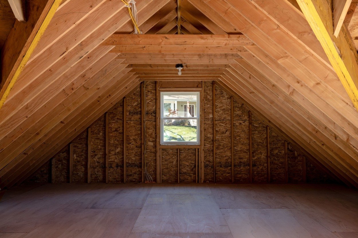 attic with wood framing in custom home by GTG Builders in Central New Jersey