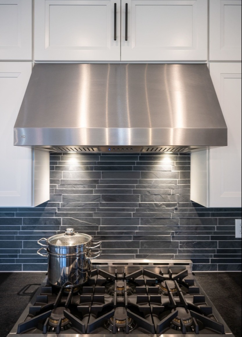 close up shot of a stovetop with pot in custom home in central new jersey by GTG Builders 