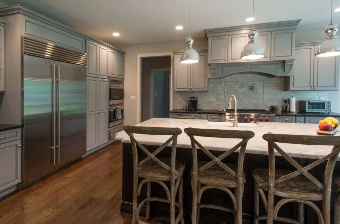 kitchen with white island, grey cabinets, and large refrigerator in custom home by gtg builders in central new jersey kitchen with white island, grey cabinets, and large refrigerator in custom home by gtg builders in central new jersey