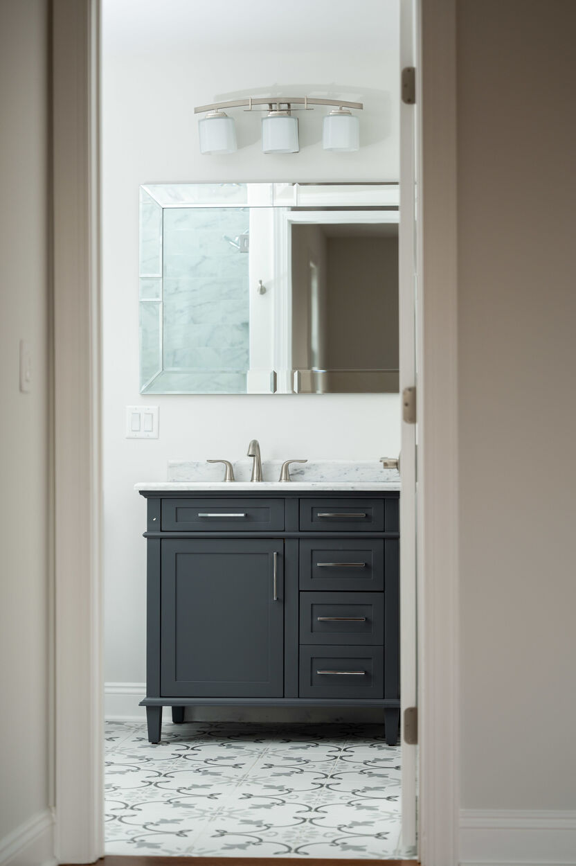 bathroom with sink and dark cabinets in custom home by gtg builders in central new jersey