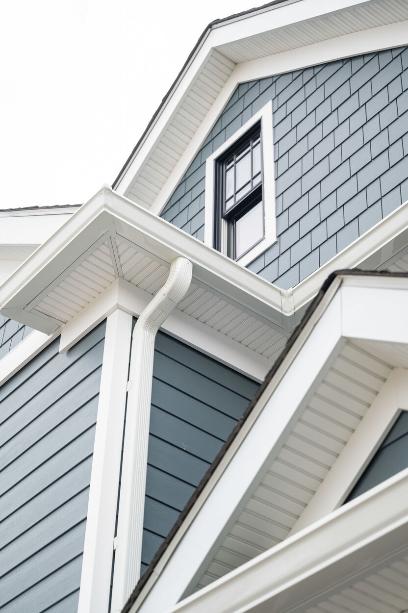 close up of custom home roof with blue paneling by GTG builders in central new jersey