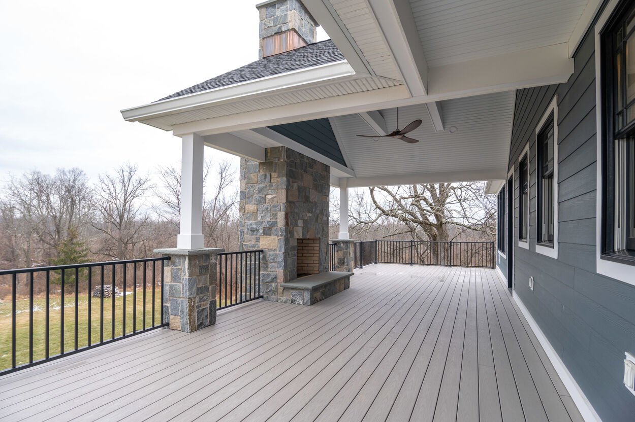back patio with wood planks in custom home by gtg builders in central new jersey