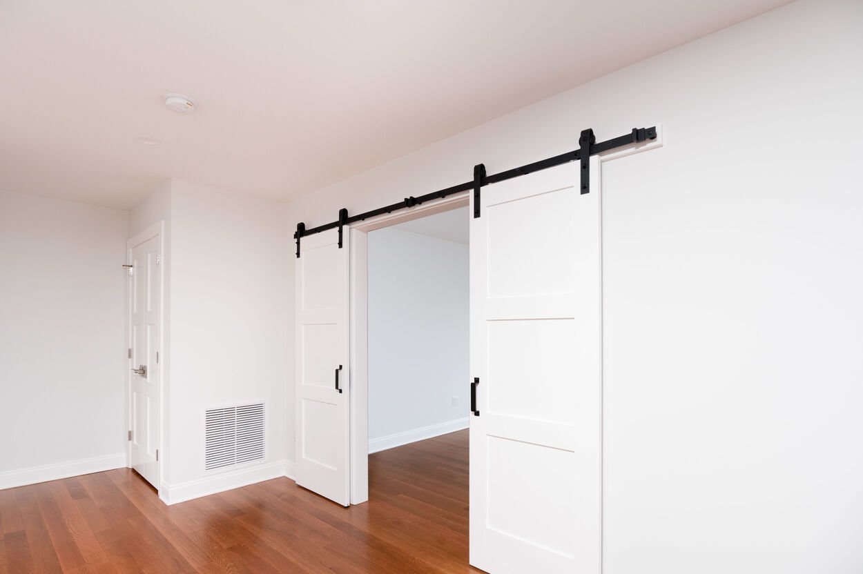 white barn doors in custom home by gtg builders in central new jersey