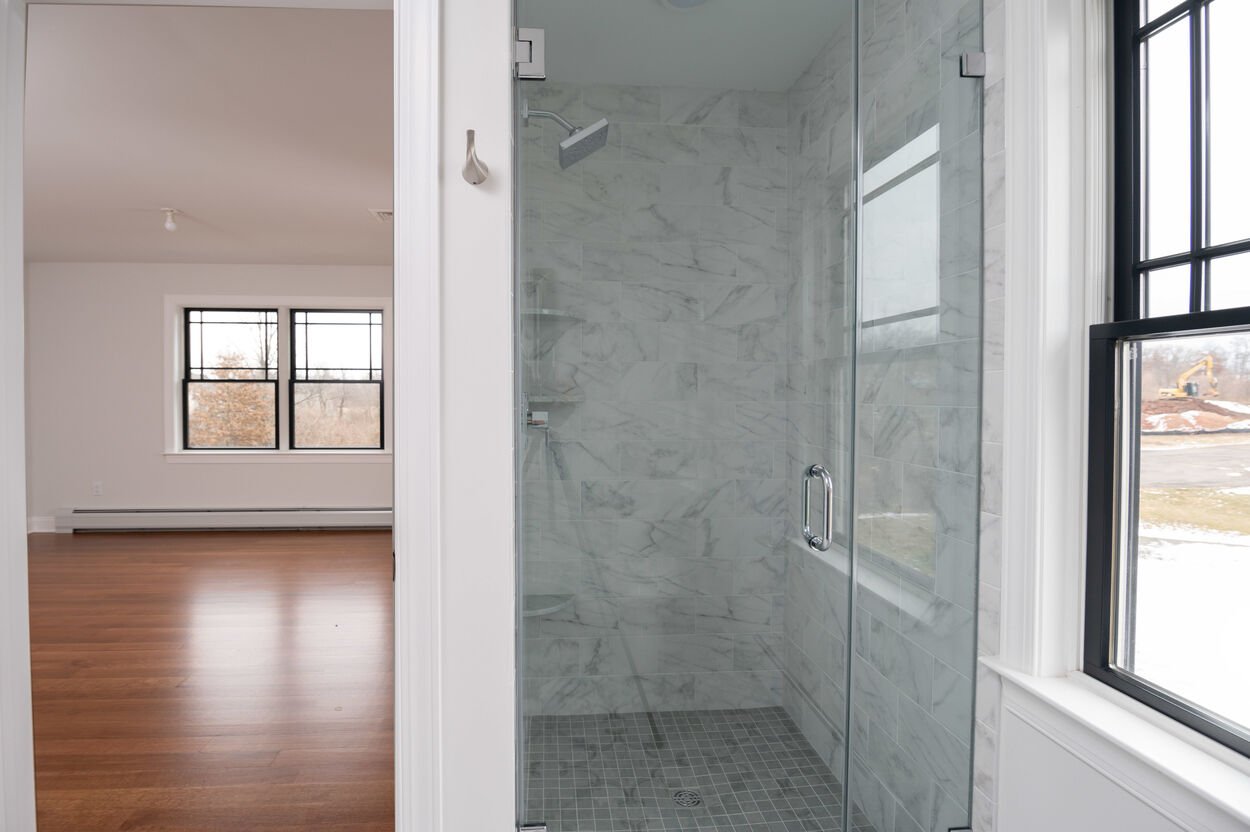 walk in shower in guest room in custom home by gtg builders in central new jersey