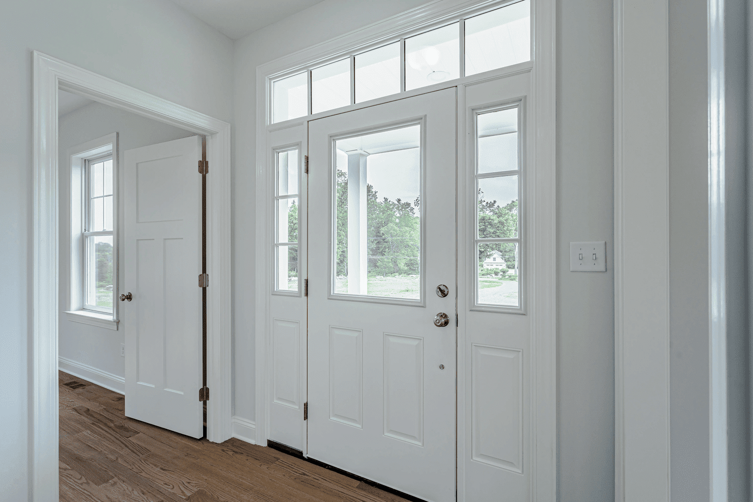 white main door in custom home by gtg builders in central new jersey