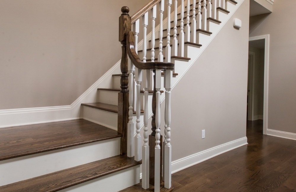 close up of staricase with hardwood floors in custom home by gtg builders in central new jersey