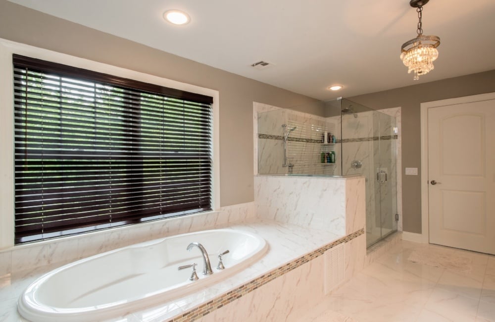 bathroom with tub and walk in shower in custom home by gtg builders in central new jersey