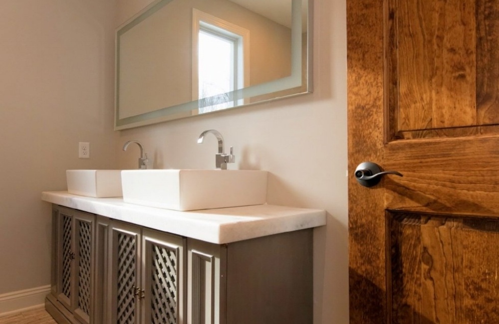 inside bathroom with double vanity in custom home by gtg builders in central new jersey