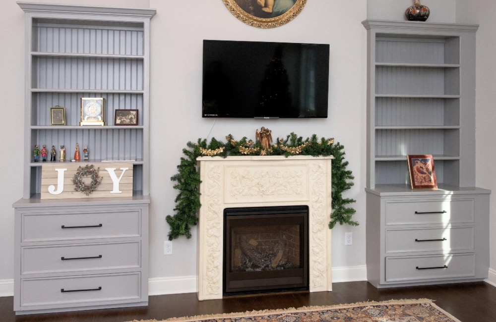 living room with fire place and tv in custom home by gtg builders in central new jersey 