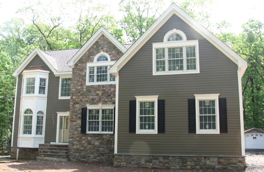 exterior of custom home with panel and stone by gtg builders in central new jersey exterior of custom home with panel and stone by gtg builders in central new jersey