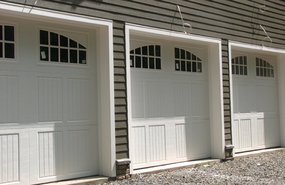 exterior of custom home with 3 car garage by gtg builders in central new jersey