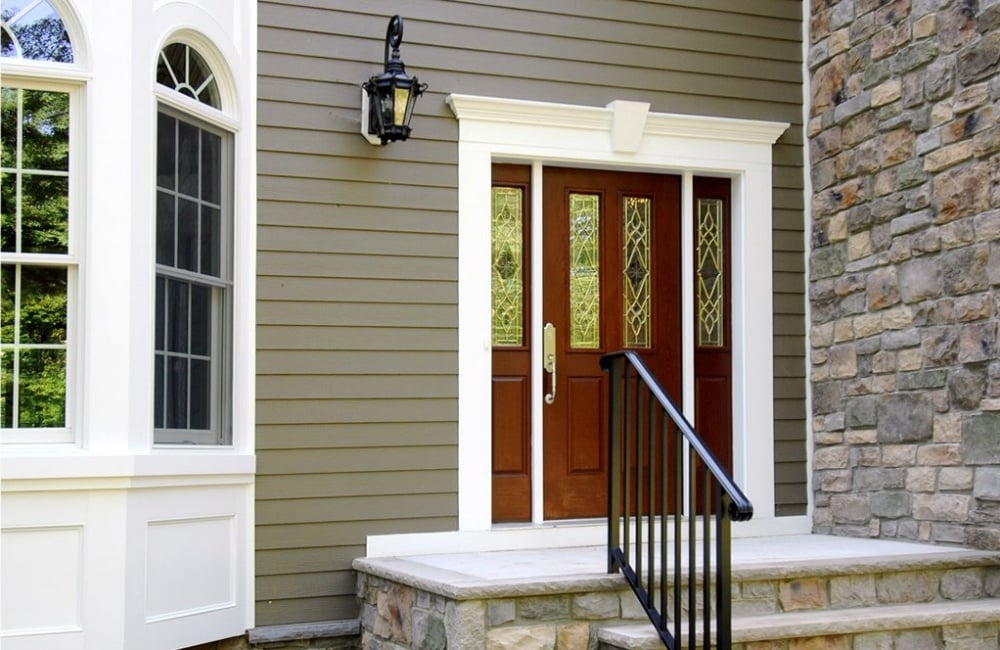 exterior of custom home with panel and stone by gtg builders in central new jersey