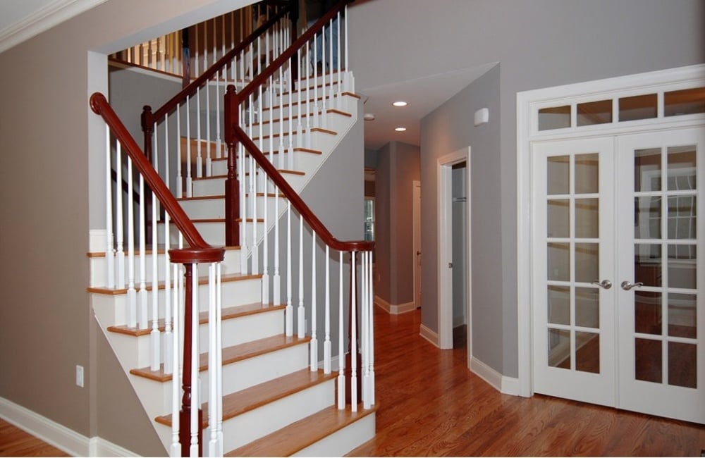 staircase inside custom home with hardwood floors by gtg builders in central new jersey