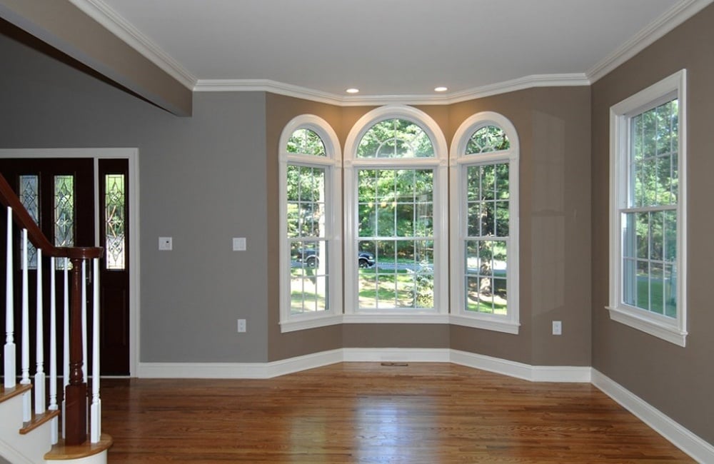 living area in custom home with bay window by gtg builders in central new jersey