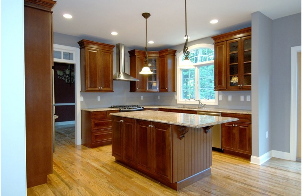 kitchen inside custom home with brown cabinets by gtg builders in central new jersey